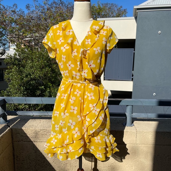 Bardot Dresses & Skirts - Bardot Yellow Daisy Abstract Mini Wrap Dress